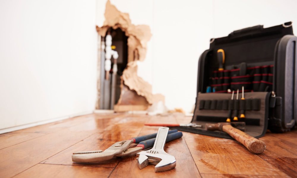 Tools and toolbox lying on flood damaged floor